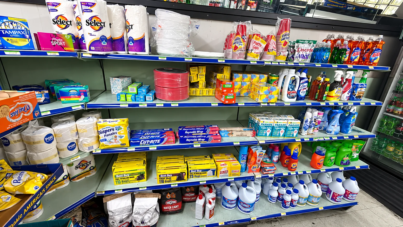 Household and personal care supplies stocked on shelves