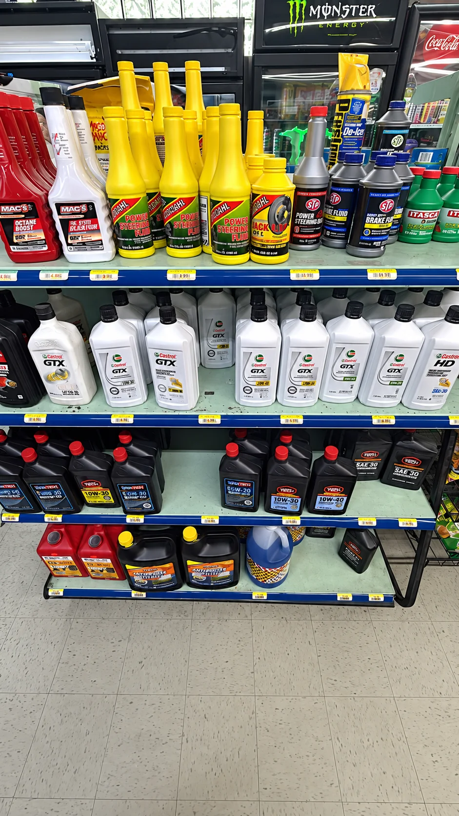 Motor oil and automotive fluids displayed on shelves